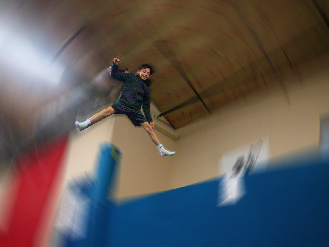 Athlete performing a straddle jump