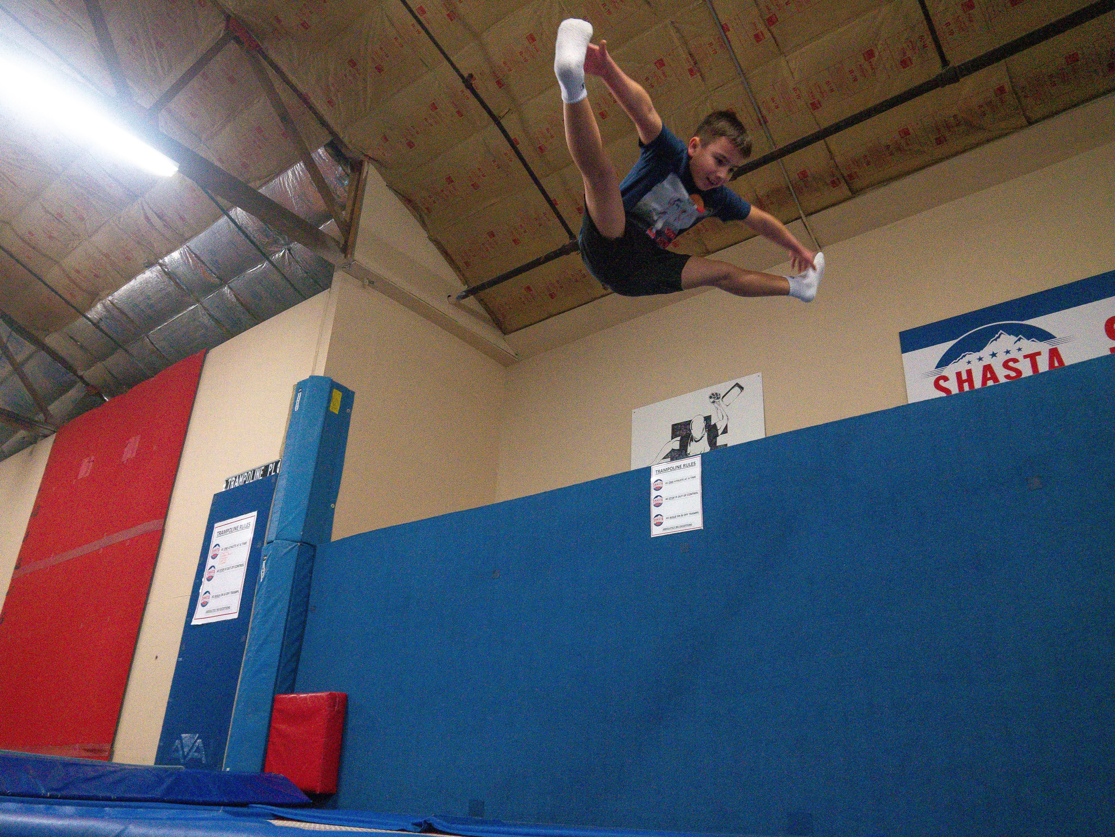 Athlete performing a straddle jump